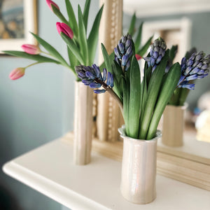 The handmade daisy vase in pastel blue with hyacinths