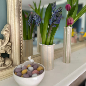 The handmade sea lavender vase in sage green with the daisy vase in pastel blue